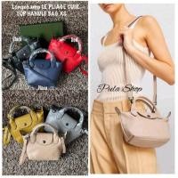 ราคา กระเป๋าสะพายหนังแกะ ขนาดมินิ XS ลองชอม L C LE PLIAGE CUIR TOP HANDLE BAG 001 005 (29500951291)