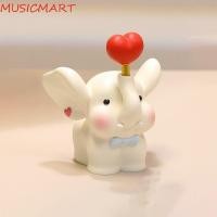 ราคา Musicmart ตุ๊กตาช้างหัวใจ สัตว์มือวาดคู่รูปปั้นช้าง การ์ตูนโชคดีตกแต่งเรซิ่นช้างเครื่องประดับตกแต่งบ้าน (28622632031)