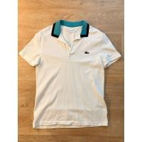 ราคา เสื้อโปโลจากแบรนด์ Lacoste ของแท้ ลาคอสท์ สีขาวปกเขียว อก 46 ซม สภาพ 98 ใส่สบาย (42273177148)