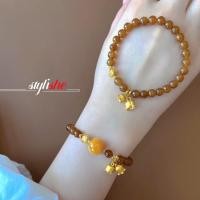 ราคา สร้อยข้อมือลูกปัดหินธรรมชาติสีคาราเมลสําหรับผู้หญิง เลียนแบบบุษราคัมลูกปัดสร้อยข้อมือดอกไม้สีทองเครื่องประดับแฟชั่นจีนอุปกร (29577370590)