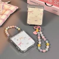 ราคา โบว์สีสันสดใสเหมาะสําหรับ Samsung Galaxy ZFlip7 ZFlip6 เคสโทรศัพท์หน้าจอพับ Zflip5 ใหม่ Zflip4 กระเป๋าบานพับ Zflip3 สร้อยข้อมือโปร่งใสหญิง Niche ShockProof ฝาครอบป้องกัน (48951559346)