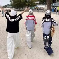 ราคา TIANLESIWEI เสื้อยืดแขนสั้นตัวอักษรสะท้อนแสงฤดูร้อนสไตล์ High Street สไตล์คู่หลวม (49057325165)