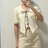 ราคา ส่งต่อ เสื้อคอปกสีครีม ดีเทลผูกโบว์ด้านหน้า no brand (49209676713)