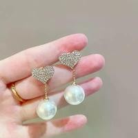 ราคา ต่างหูหัวใจ ฝังมุก เข็มเงิน S925 เพชรเต็ม ต่างหูมุกรูปหัวใจ ใส่ได้สองทาง ต่างหูสตั๊ดหรูหรา สำหรับผู้หญิง กรอบ พระ หลวงปูทวด แหวน สลัก มือ จิว เทียน มังกร คู่ หลวง ปู่ หมุน (1731276851604063702)