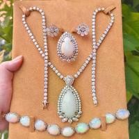 ราคา โอปอลล์ เอธิโอเปียดิบ ล้อมเพชรโมซาไนท์ ชุดสร้อย จี้ แหวน เงินชุบทอง (1733437481811150182)