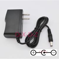 ราคา AC DC 9V 500mA 1000mA 1A Power Supply Adapter อะแดปเตอร์เพาเวอร์เอฟเฟกกีตาร์เหยียบ US plug guitar foot pedal Board Effect adapter Reverse Polarity Negative Inside (16456706662)