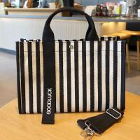 ราคา กระเป๋าถือลายทางสไตล์ญี่ปุ่นกระเป๋าโท้ทผ้าใบกันน้ำความจุใหญ่กระเป๋าผ้าใส่เอกสารขนาด a4กระเป๋าผู้หญิงสะพายข้างแบบลำลองแมทช์ลุคง่าย (20471396361)