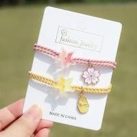 ราคา ยางมัดผมแฟชั่น ยางรัดผมลายเชือก สีพาสเทล ห้อยจี้รูปดาว จี้ดอกซากุระ น่ารัก ยางรัดผม มี 4 แบบ เลือกแบบได้ (19199881812)