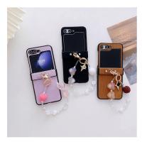 ราคา สำหรับ Samsung Galaxy Z Flip 5 Z Flip 3 Z 4 OPPO Find พลิก N3 N2 OPPO Find พลิก Vivo X ผ้าลูกฟูกแฟชั่นพลิกพร้อมจี้สร้อยข้อมือลูกปัดถักเคสโทรศัพท์มือถือแบบพับ TPU (21173175153)