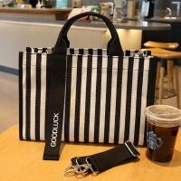 ราคา กระเป๋าถือลายทางสไตล์ญี่ปุ่นกระเป๋าโท้ทผ้าใบกันน้ำความจุใหญ่กระเป๋าผ้าใส่เอกสารขนาด a4กระเป๋าผู้หญิงสะพายข้างแบบลำลองแมทช์ลุคง่าย (20471396364)