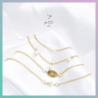 ราคา petite by PRAKYRE Estrella with Pearl Multi Bracelet สร้อยข้อมือสีทองลายดาวประดับมุข 4 เส้น (20798780513)