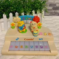ราคา เปียโนเล็กยี่ห้อ Combi มีเสียง มีไฟ ตุ๊กตาขยับได้ (3835161695)