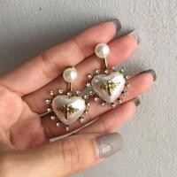 ราคา ต่างหูมุกผึ้งล้อมเพชร (1554650903)