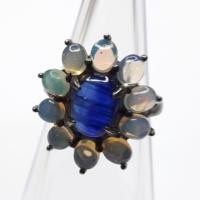 ราคา แหวน ไคยาไนท์ ( Kyanite ) ขนาดพลอย 10 มม.หลังเบี้ย ล้อมโอปอล ( Opal ) น้ำเงินสวยมาก ตัวเรือนเงิน 925 ชุบดำคลาสสิค (6343145191)