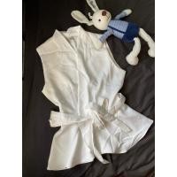 ราคา เสื้อแขนกุด สีขาว คอป้ายผูกเอว ชายระบาย ผ้าสวย (25052471315)