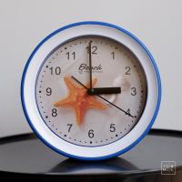 ราคา [พร้อมส่ง] Tomuhouse นาฬิกาปลุก ตั้งโต๊ะ แขวน ทรงกลม ขนาด 6 นิ้ว มี 4 ลาย เปลือกหอย ประภาคาร ปลาดาว พวงมาลัยเรือ พลาสติก (7063043322)