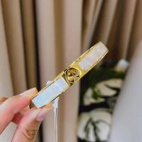 ราคา ของแท้ส่งฟรี‼️กำไลข้อมือ KATE SPADE HOLE PUNCH SPADE HINGE BANGLE (24151405781)