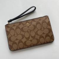 ราคา COACH LARGE WRISTLET IN SIGNATURE CANVAS #F58695 (4951447847)