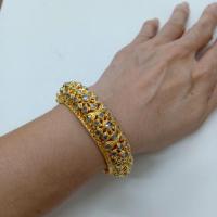 ราคา กำไลข้อมือสุโขทัยเพชรซีกโบราณฉลุลายดอกไม้รอบวงแบบสวยงามเส้นผ่าศูนย์กลางประมาณ5.5ซม.ตัวเรือนเหรียญสตางค์ชุบทองไมครอน (43160595894)
