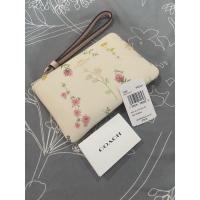 ราคา ส่งฟรี คล้องมือ 1S สีขาวลายดอก COACH 7249 CORNER ZIP WRISTLET WITH SPACED WILDFLOWER PRINT (11630649988)