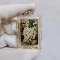 ราคา จี้รูปถ่ายแม่ชีบุญเรือน โตงบุญเติม ด้านหลังบรรจุพระพุทโธน้อย และผงพุทธคุณศิลาน้ำ (15499855257)