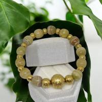 ราคา สร้อยข้อมือหินทิเบตหินเก่าลวดลายชัดสีเขียวอมเหลืองเม็ดทองโลหะสีใหม่สวย (49350835774)