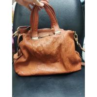 ราคา กระเป๋า finn​ esker แท้มือสอง หนังช้าง สีส้มน้ำตาลสวย (14446632584)