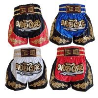 ราคา กางเกงมวยไทยผ้าซาตินสองสีตกแต่งด้วยผ้าดิ้นสีทองติดอักษรมวยไทยด้านหน้า (6380362758)