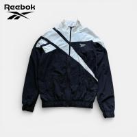 ราคา เสื้อแจ็คเก็ตมือสอง Reebok สีดำ ลายโลโก้คลาสสิค ผ้าร่ม อก 44 ยาว 28 สภาพใหม่ ไม่มีตำหนิ (51554286758)