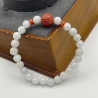 ราคา สร้อยข้อมือหยก สีขาวประดับตัวแกะสลักแดง แต่งบีดิสแดง A75 (23246493843)