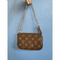 ราคา LV POCHETTE MINI EBENE MONOGRAM CANVAS GHW (22975982707)