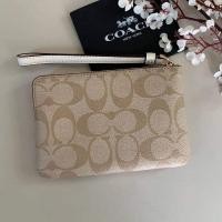 ราคา CORNER ZIP WRISTLET IN SIGNATURE COATED CANVAS WITH LEATHER STRIPE (COACH F58035) (9608324749)