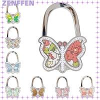 ราคา ZENFFENBC ไม้แขวนเสื้อ, ตะขอแขวนกระเป๋าผีเสื้อลายดอกไม้พับได้, แฟชั่นแบบพกพาโลหะผสม Creative กระเป๋าถือตะขอสําหรับโต๊ะ (58109424816)