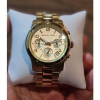 ราคา Michael kors รุ่นโมเมสีทอง มือสอง ของแท้% สภาพ 90% (8756440884)