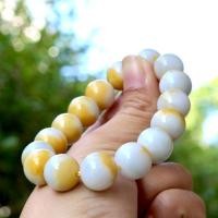 ราคา สร้อยข้อมือหยกขาวติดเหลืองน้ำผึ้ง ขนาดเม็ดหยก 13 mm (27174109758)