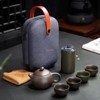ราคา ชุดน้ำชาเครื่องลายครามจีน กาต้มน้ำดินเผา Yixing ดินเหนียวสีม่วง ชุดน้ำชา Kung Fu ชุดเดินทาง 1 หม้อ 4 ถ้วย 1 โถ 130ml 5 ชิ้น (1731268332934038681)