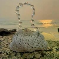 ราคา Seashell crochet clutch bag wood strap- กระเป๋าถือ รูปทรงเปลือกหอย สายคริสตัล (1732149654209464015)