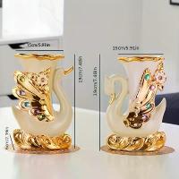 ราคา แจกัน เซรามิก รูปหงส์ สไตล์ยุโรป เรียบหรู ชุด 2 ชิ้น เหมาะสำหรับแจกันดอกไม้ในห้องนั่งเล่นและตู้ทีวี ตกแต่งในร่มสร้างสรรค์ ตกแต่งแจกันดอกไม้แห้ง กุมารทองหลวงพ่อเต๋ รุ่น (1732529565236036830)