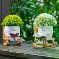 ราคา กระถางต้นไม้รูปทรงเก้าอี้โยกพร้อมตัวการ์ตูนน่ารักกำลังอ่านหนังสือ 1 ชิ้น, แจกันเรซินสำหรับปลูกต้นไม้, กระถางดอกไม้ตกแต่งสำหรับปลูกต้นไม้, กระถางปลูกกระบองเพชรสำหรับจัดสวนในลานบ้า (1734453952728499969)