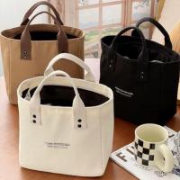 ราคา 【ประเทศไทย จัดส่ง 24 ชั่วโมง】กระเป๋าถือผ้าแคนวาส ความจุมาก อเนกประสงค์ สไตล์ญี่ปุ่น กระเป๋าโท้ทลำลอง แฟชั่น เหมาะสำหรับอาหารกลางวันและเบนโตะ ดีไซน์เรียบง่าย สีทึบ กระเป๋าถือ (1731584081238656818)