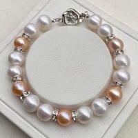 ราคา สร้อยข้อมือไข่มุกแท้ มุกภูเก็ต สีขาวคั่นบอลเพชรตัดด้วยไข่มุกสีส้มพีช (13501259662)