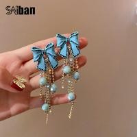 ราคา Saiban สไตล์เกาหลีต่างหูผู้หญิง 925 เงินเข็มพู่เงาเพชรคริสตัลโบว์ต่างหูSaiban Korean Style Women Earrings 925 Silver Needle Tassel Shiny Diamond Crystal Bow Earrings (9461008714)