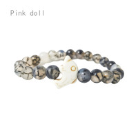 ราคา หินภูเขาไฟปลาโลมาตุ๊กตาสีชมพูเทอร์คอยซ์ขาวกำไลอิลาสติกหินธรรมชาติต่างๆสำหรับผู้ชายและผู้หญิง (20358403313)