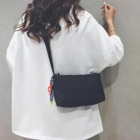 ราคา กระเป๋าผ้าใบสีขาวดำเรียบง่ายสไตล์ญี่ปุ่นกระเป๋าใบเล็กสำหรับผู้หญิงกระเป๋าสะพายข้างลำลองแมทช์ลุคง่ายแบบใหม่ปี2023กระเป๋าสะพายไหล่เดียวสำหรับเดินทางทำงาน (19853143315)
