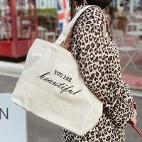 ราคา กระเป๋าผ้า ถุงผ้าสไตล์ Minimal สไตล์เกาหลี TOTE BAG พร้อมส่ง ใส่Notebook16 ปักชื่อตามสั่งได้ ผ้าหนา14ออนซ์ (20578169001)