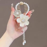 ราคา 2023 new lily of the valley hollow tassel hair clip womens high end sense diamond studded high ponytail hairball hair clip at the back of the head (21980520322)