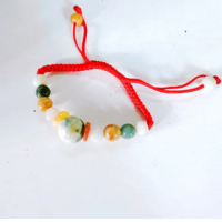 ราคา กำไลหินนำโชค กําไลหยกหลวงปู่ศิลา ด้ายแดงหยกมงคล 9 เม็ด (22693377989)