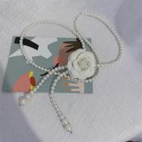 ราคา สายโซ่คล้องเอว ดอกคาเมลเลียประดับมุกลมมีกลิ่นหอมเล็กๆเสื้อเดรสแบบมีเข็มขัดอเนกประสงค์ลายดอกไม้สีดำและสีขาวตกแต่งสายโซ่รัดเอว (22730195807)