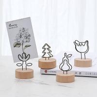 ราคา ที่หนีบรูปตั้งโต๊ะ ฐานไม้ คลิปหนีบกระดาษ หนีบโปสการ์ด ใส่นามบัตร ที่เสียบกระดาษ สำหรับตกแต่งบ้าน ตั้งโต๊ะ ออฟฟิศ (21641178387)