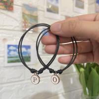 ราคา กำไลเชือก สร้อยข้อมือเชือก กำไลคู่ กำไลคู่รัก ห้อยจี้ตัวอักษรA-Z (จี้สีขาว) (22402997600)